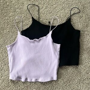 two garage black and purple tank tops